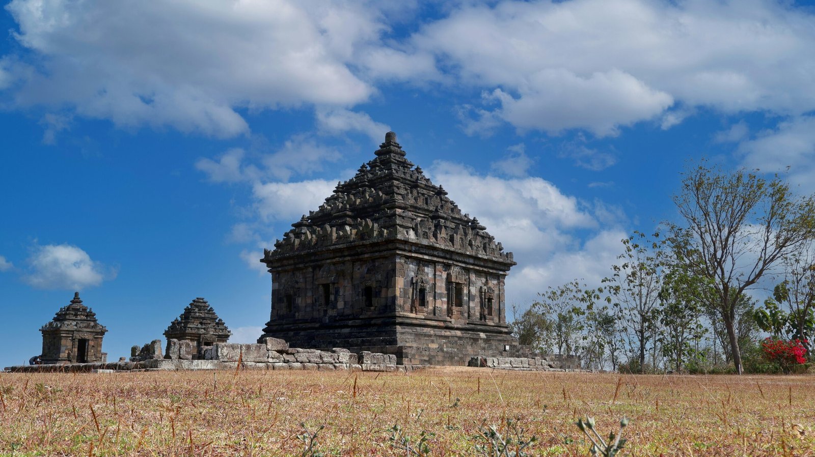 a large stone structure in the middle of a field